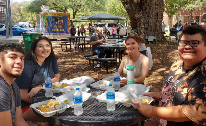Students eating tacos
