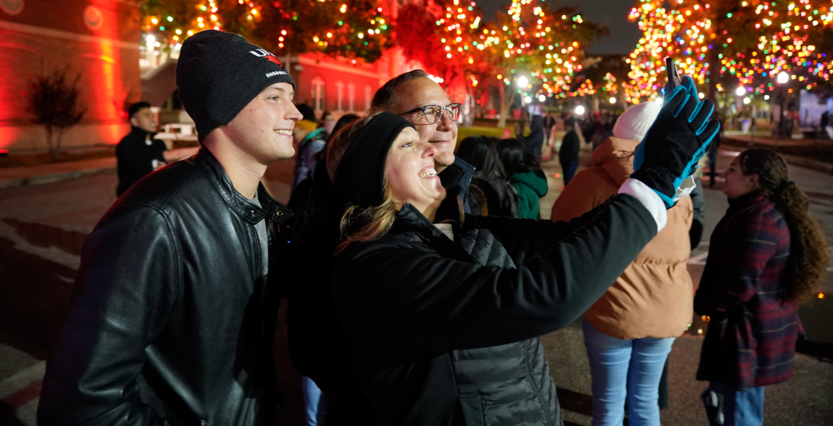 Three people take a selfie