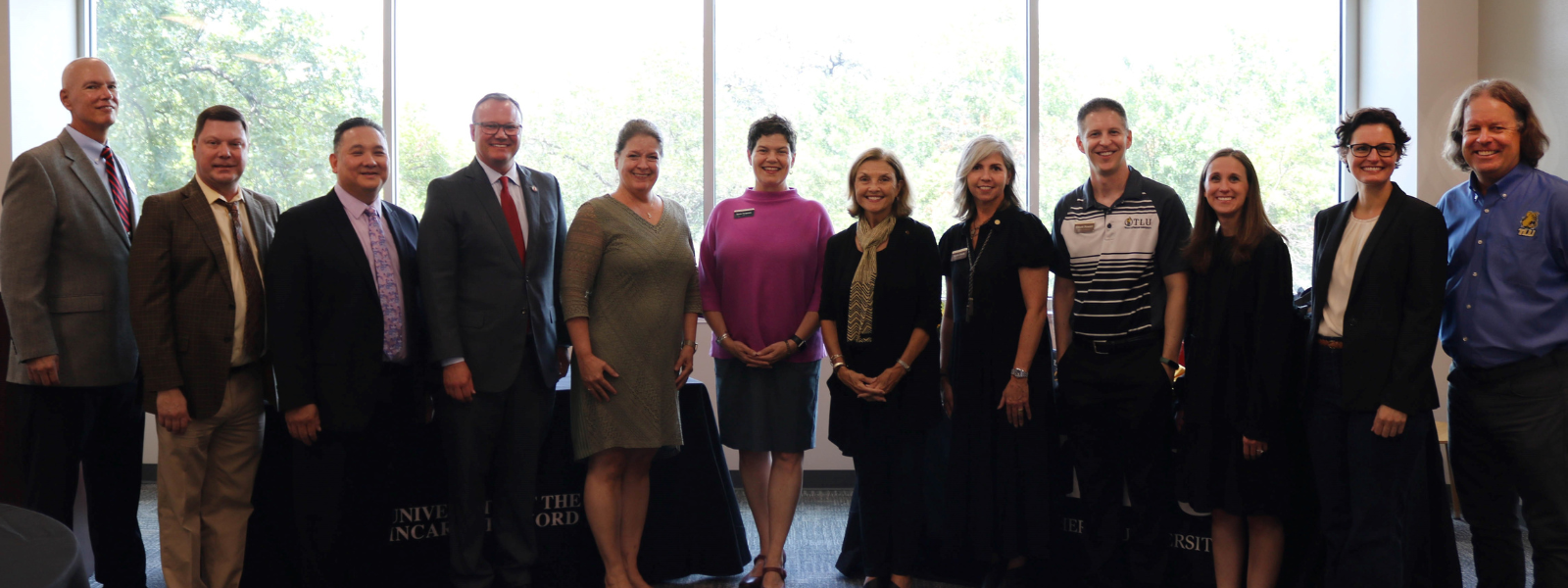 Members of UIW and TLU faculty at the signing