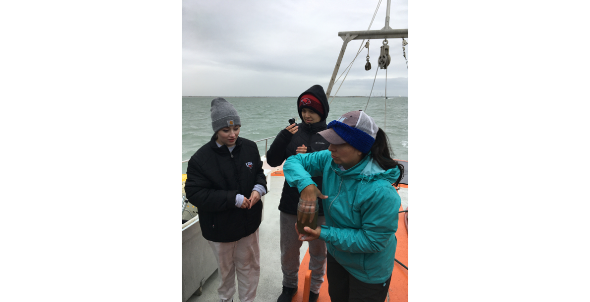 Two UIW students and Adriana Reza on a boat