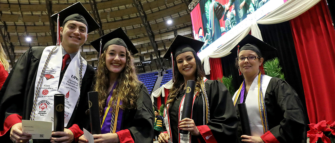 Students in cap and gown at Graduation