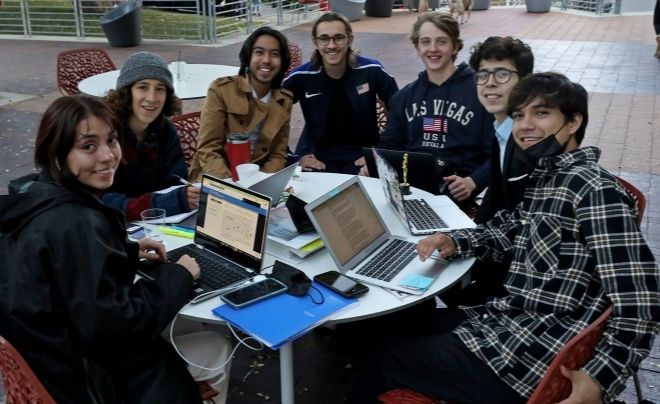 UIW students sitting on the patio of the SEC