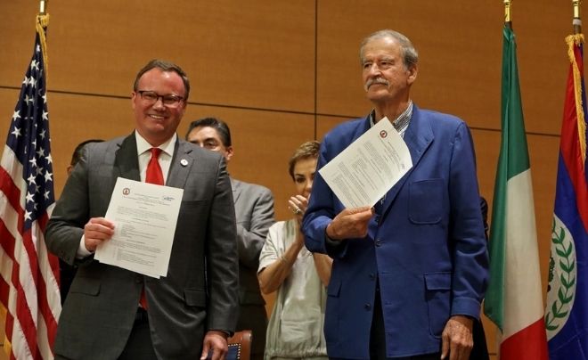 (L-R) UIW President Dr. Thomas M. Evans and former Mexican President Vicente Fox show the memorandums of collaboration signed pledging to work together in the future