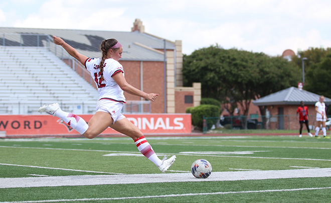 Student playing soccer