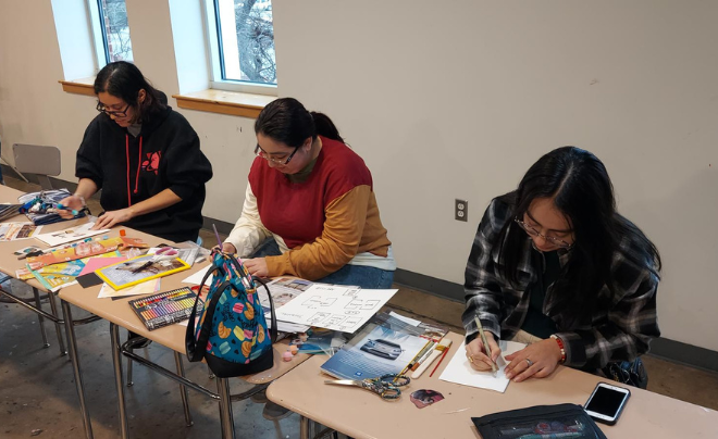 Three students doing art journaling