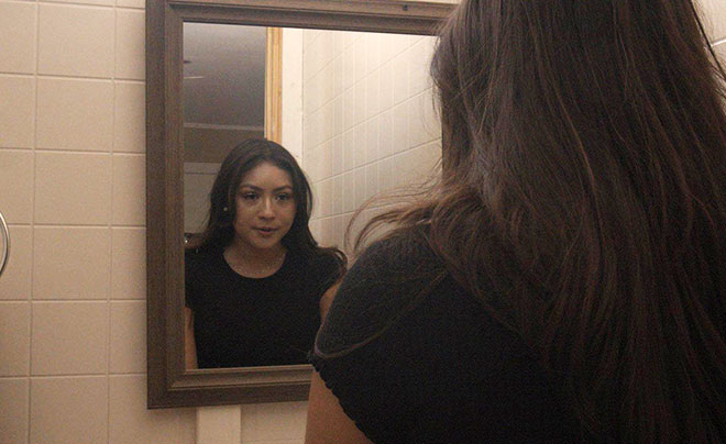 Girl looking in mirror