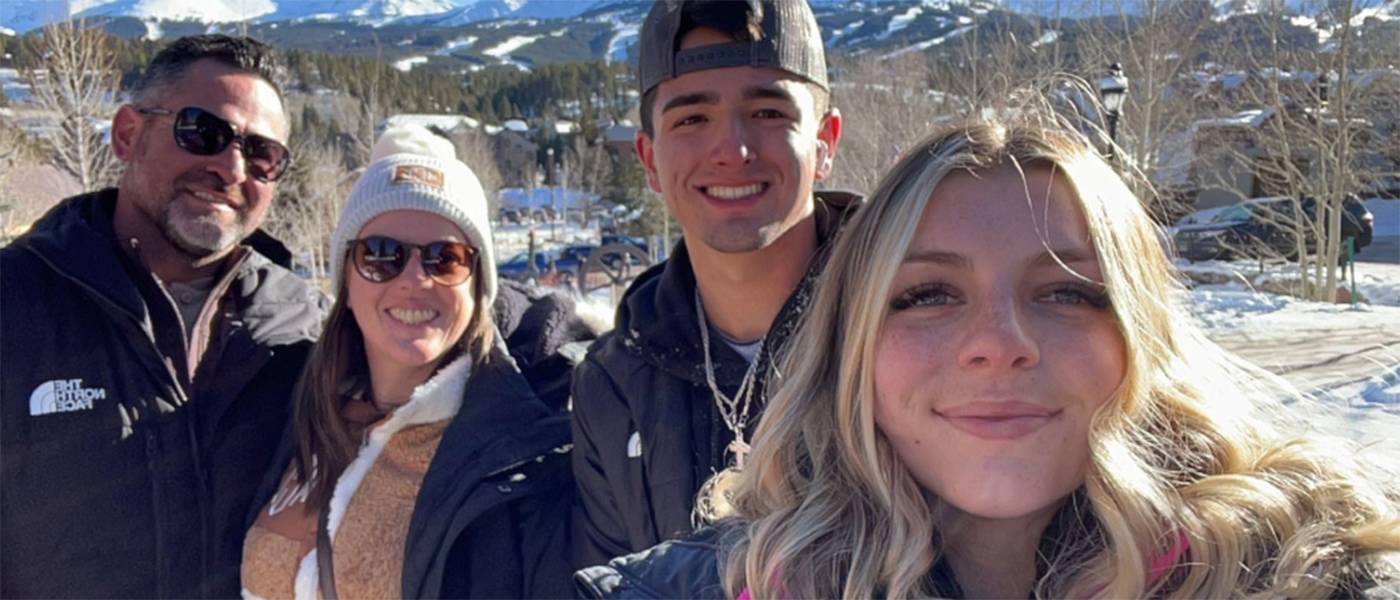 student and family outside in the mountains