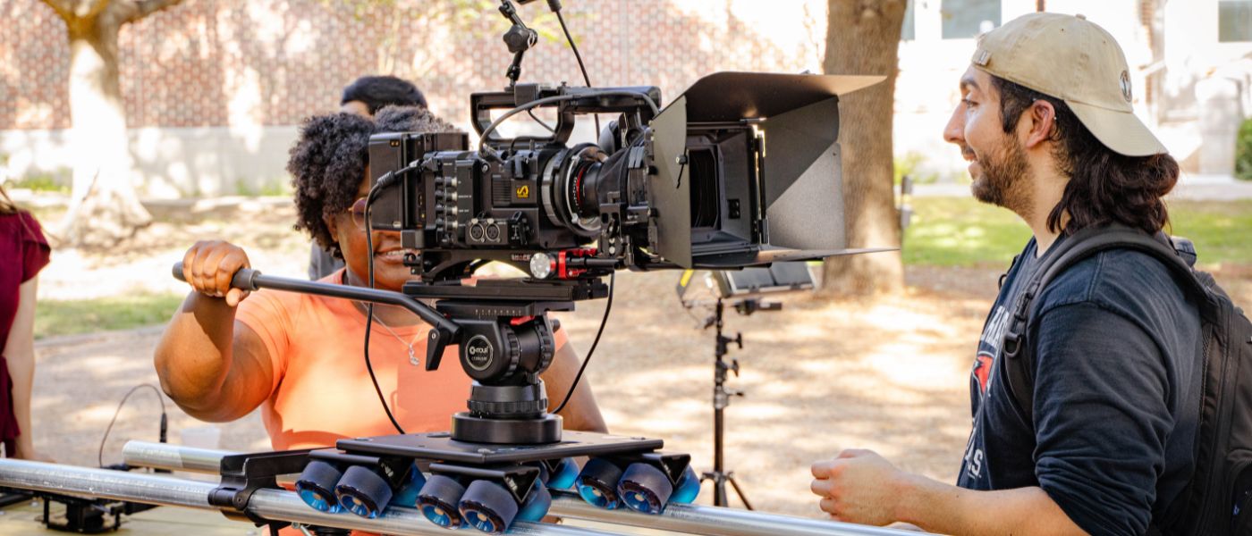 Students preparing a camera for filming