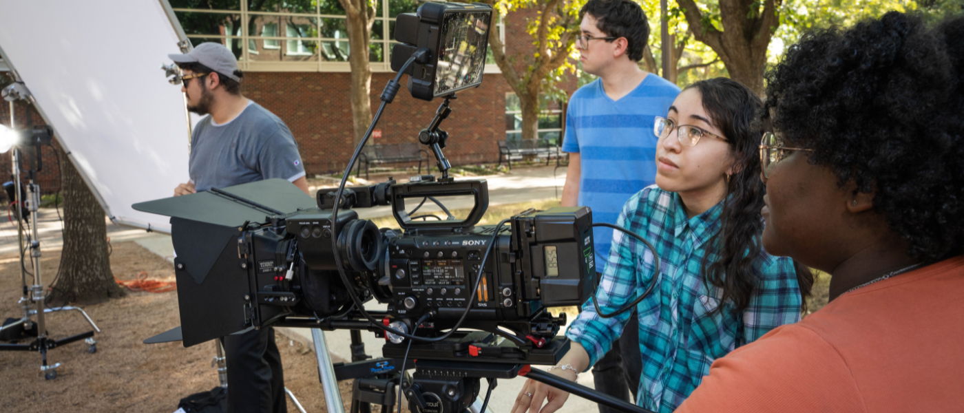 Students filming with a camera