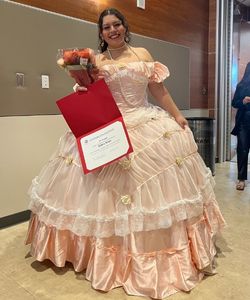 Gabby Maya in a pink ball gown