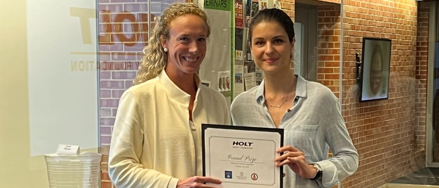 UIW student Ekaterina Lebedina receives the Holt Foundation grand prize certificate