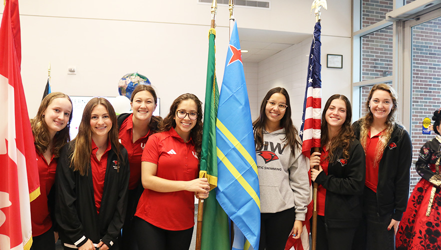 Students holding flags