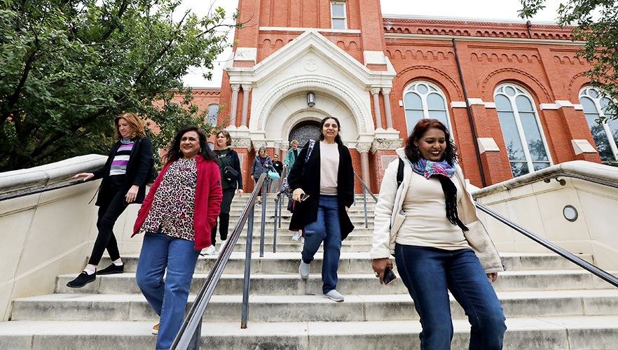 Nurses walking up chapel stairs