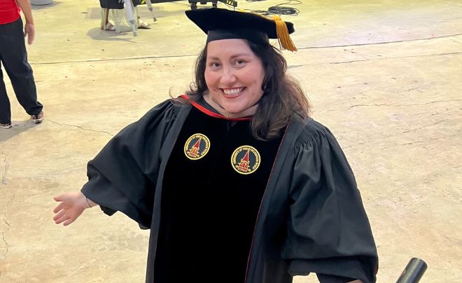 Dr. Jessica Parra wearing graduation regalia