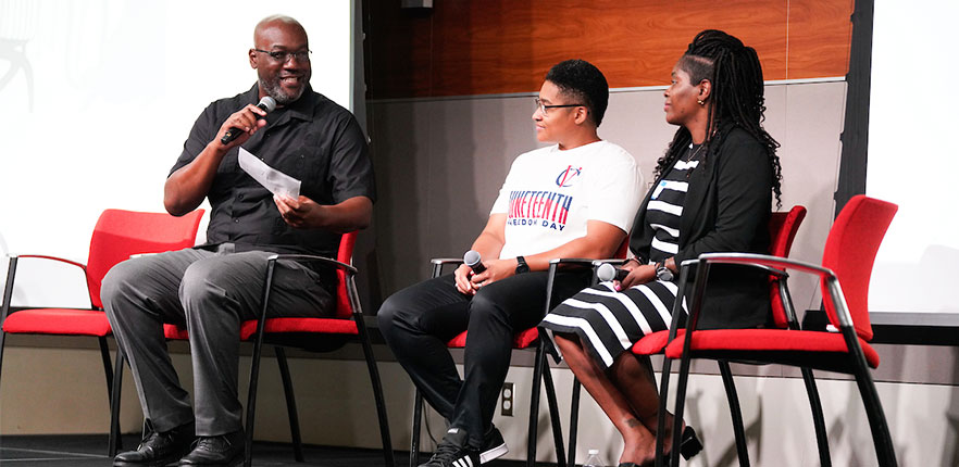 Juneteenth speaker with guests sitting in chairs