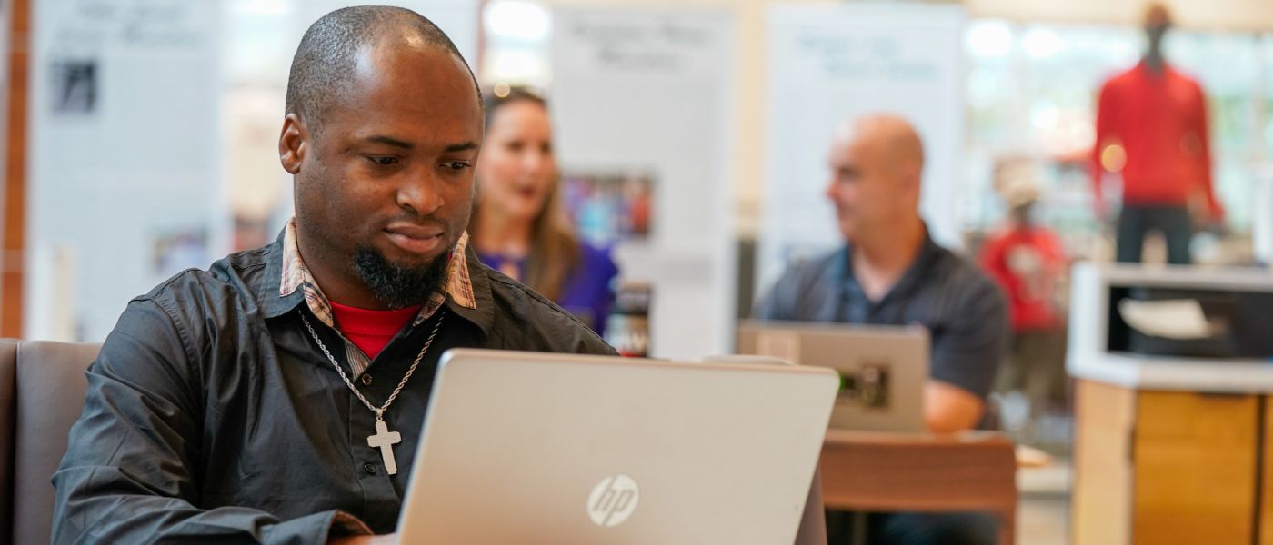 Student studying on a laptop