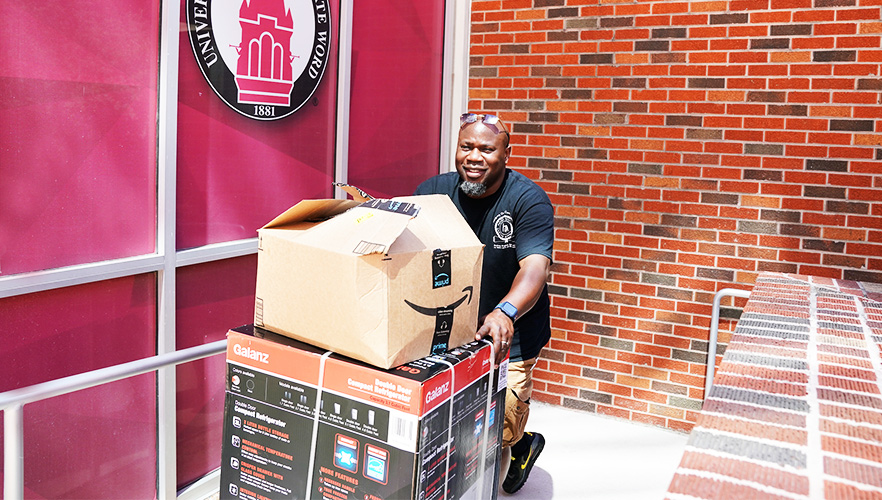 father rolling cart