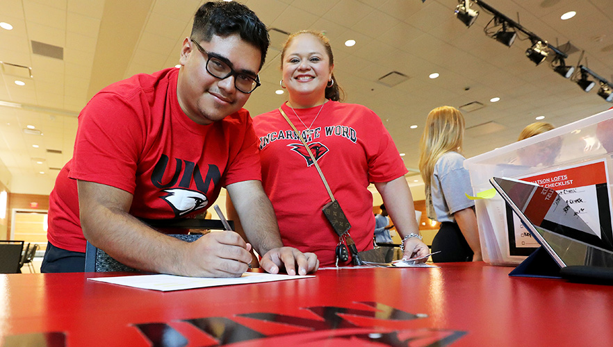 son and mother signing up for keys