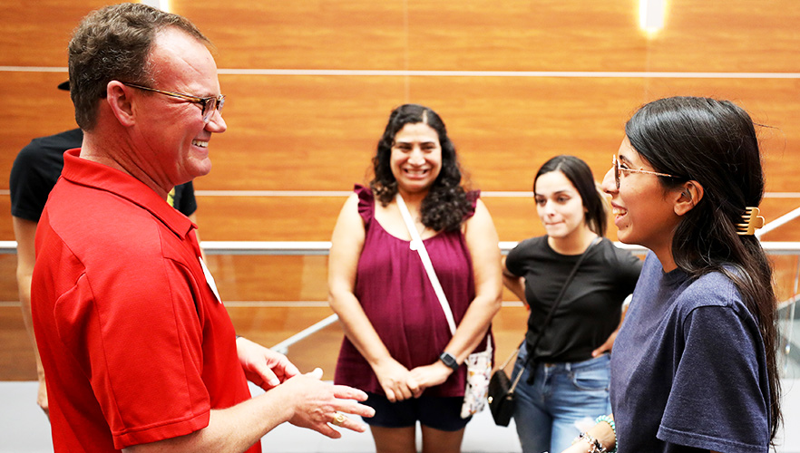 UIW President talking with families