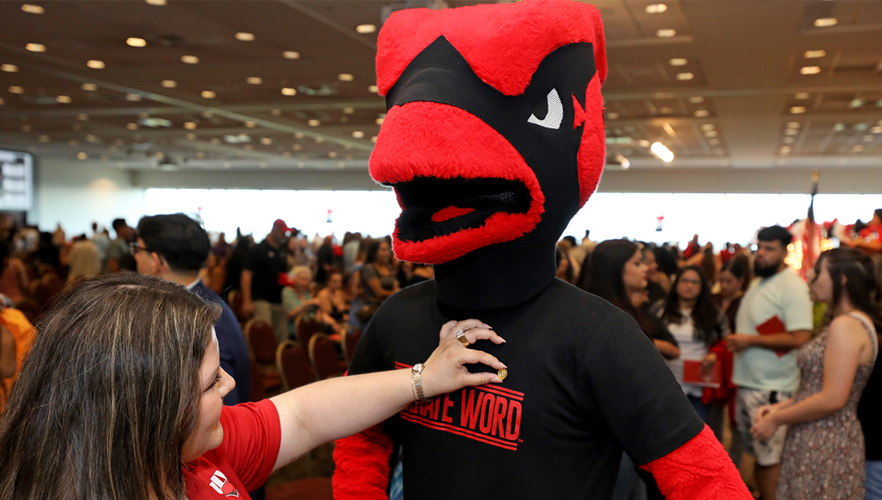 Red the cardinal being pinned on shoulder