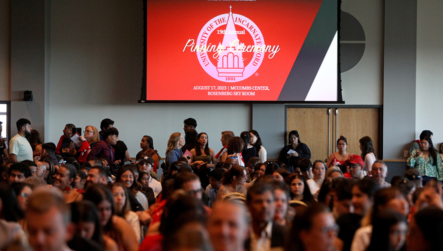 students sitting at pinning event