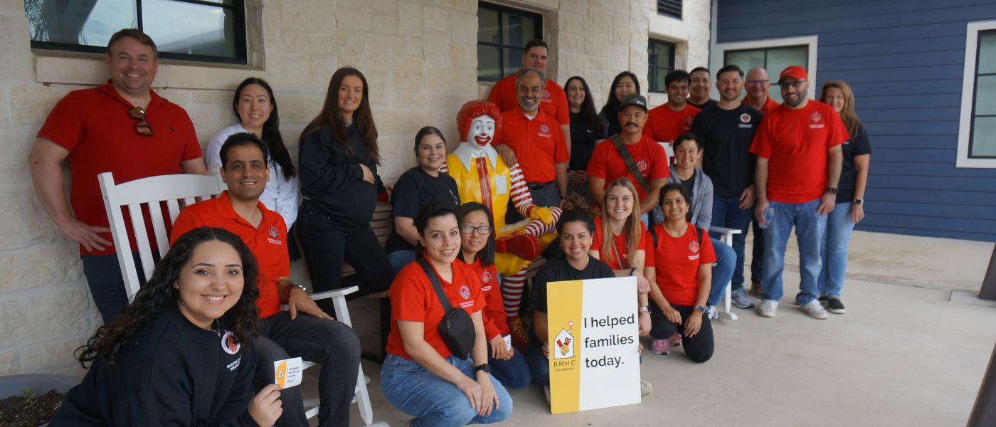 Students sitting on a porch smiling