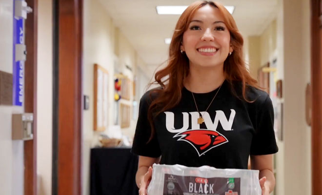 Student Helping in Thanksgiving Food Drive