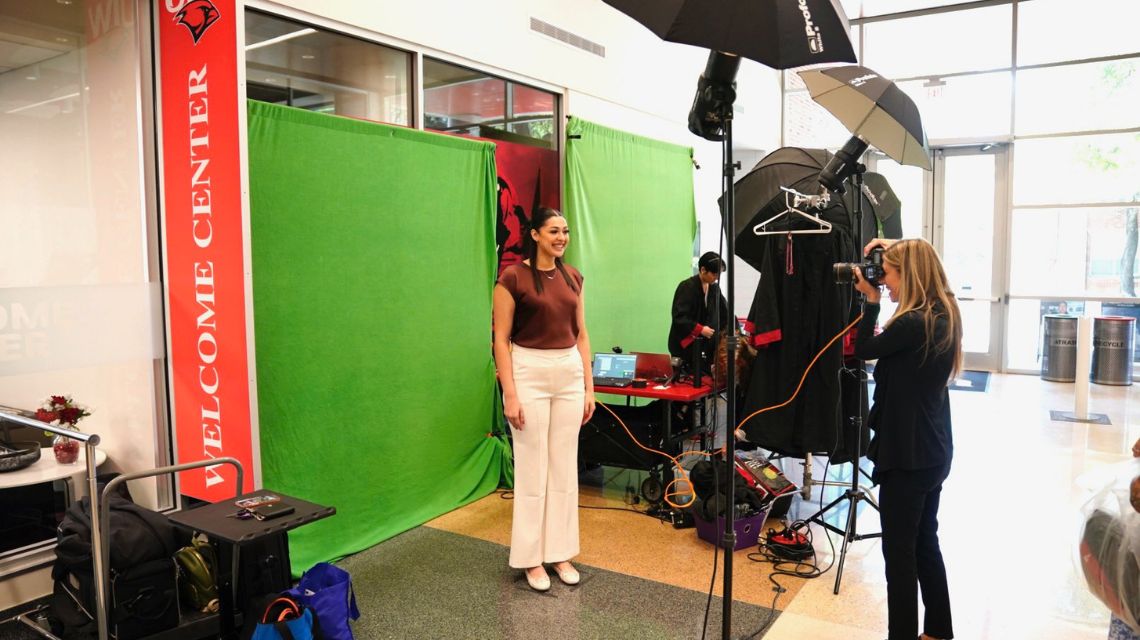 Student getting a headshot taken at Graduation Fair