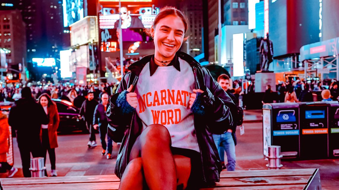 Maya Kanawati wearing Incarnate Word t-shirt in Times Square