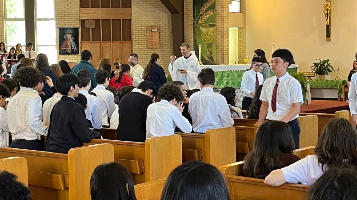 Students praying during Brainpower Mass