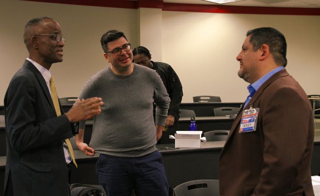 Three people chatting