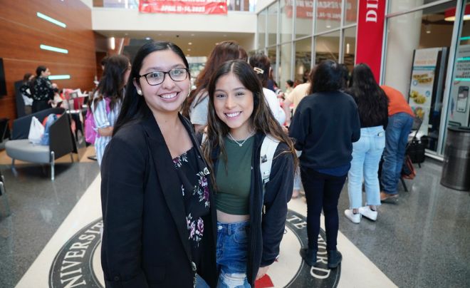 Two students at graduation fair