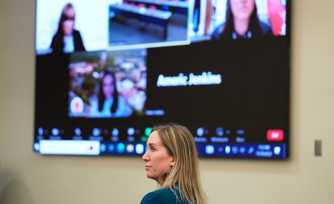 Woman in front of Zoom screen