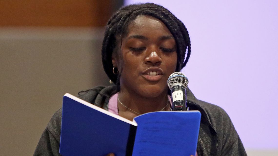 Woman reading blue book