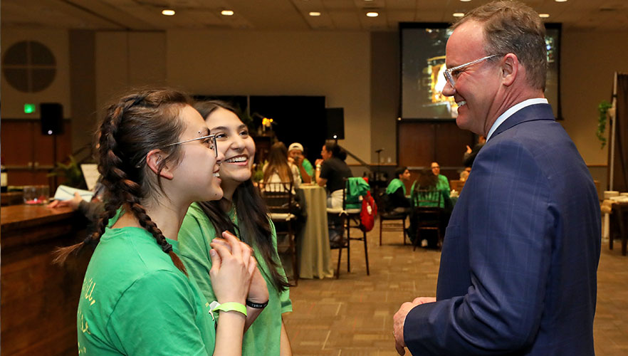 Dr. Evans talking with students.