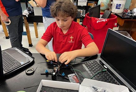 Student building drone