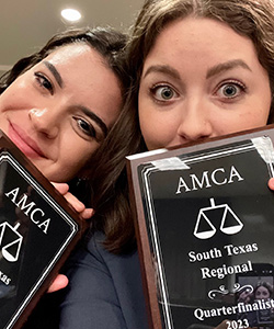 Selfie of Holland and Goeke with awards