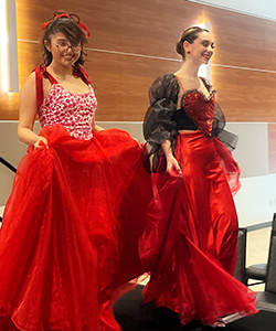 Two participating Red Dress Fashion Show students