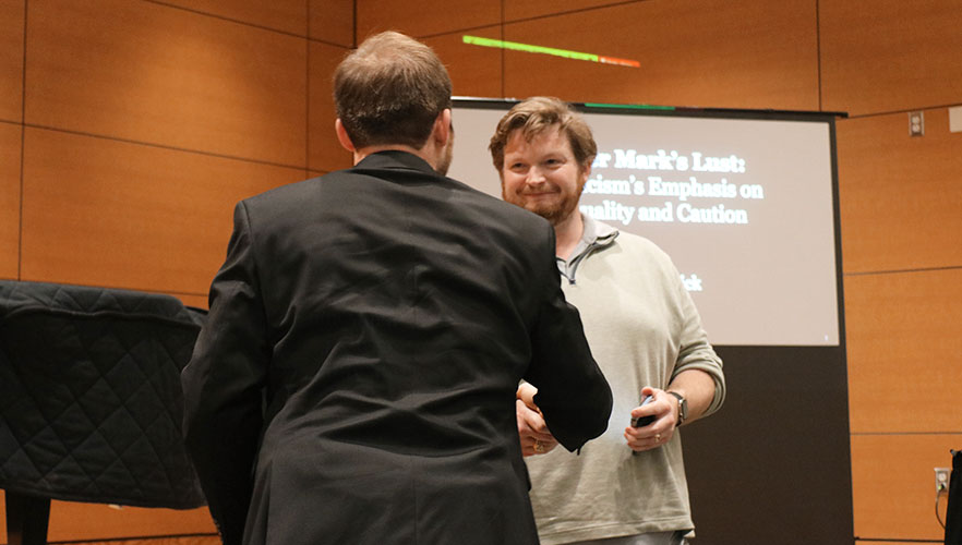 Rerick shaking hands with Dr. Kainer