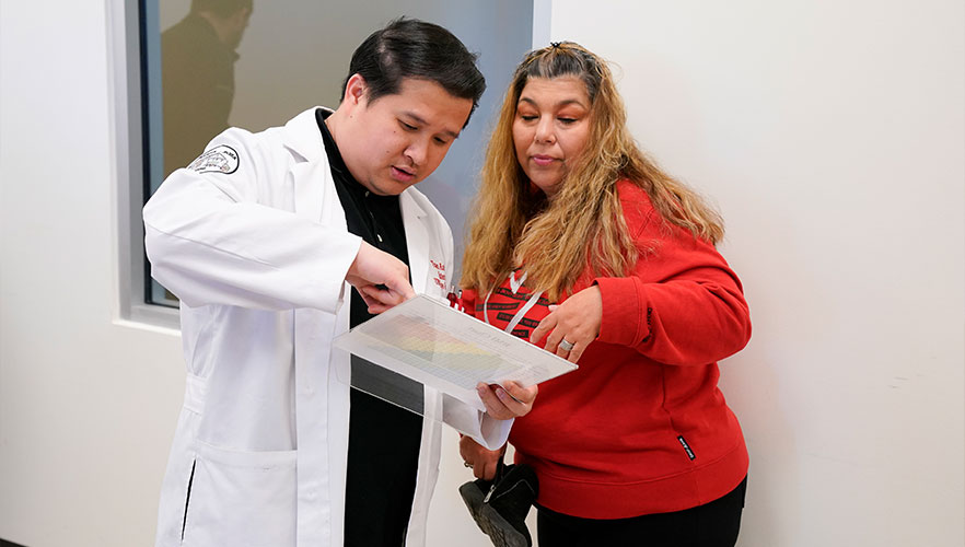 RSO student providing a health screening