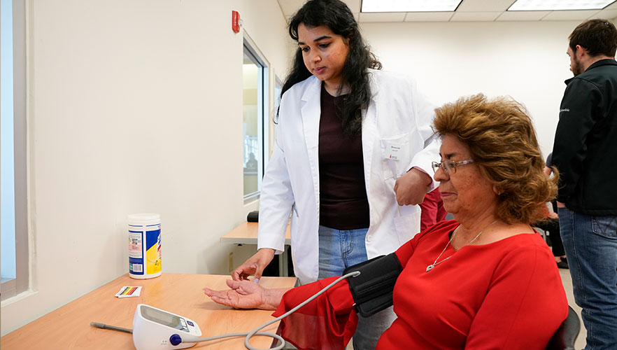 RSO student providing a health screening