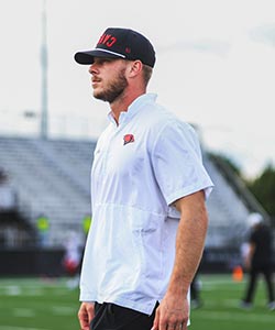 football coach walking