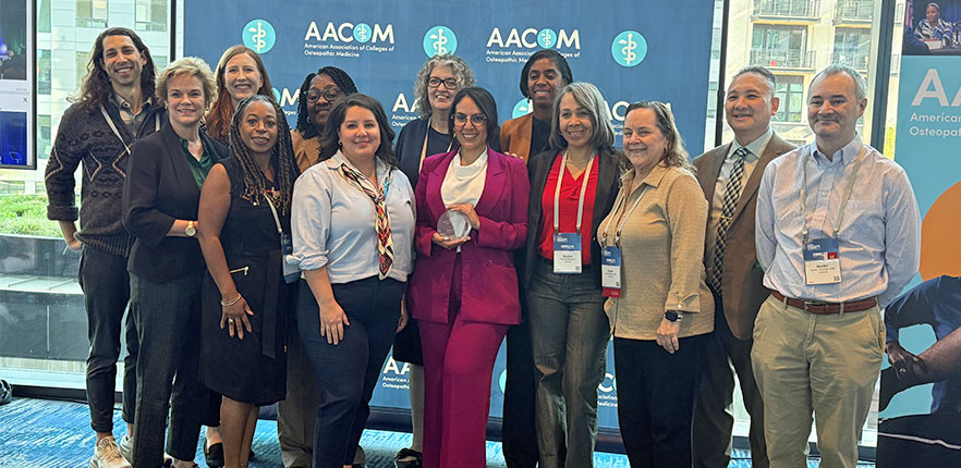 Dr. Vera receiving recognition from AACOM