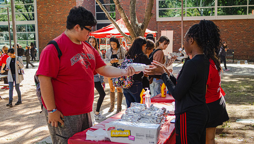 Attendees getting food