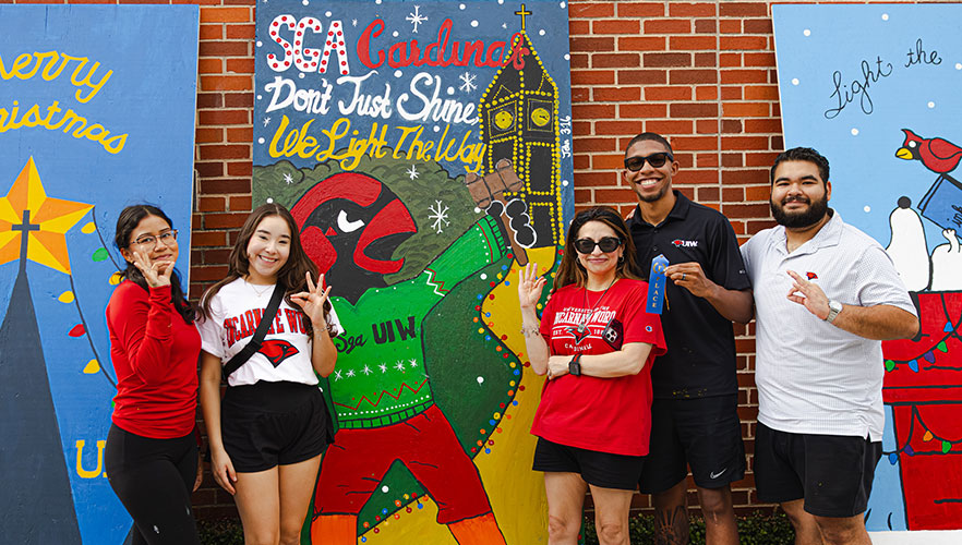 Student Government Society members with display board