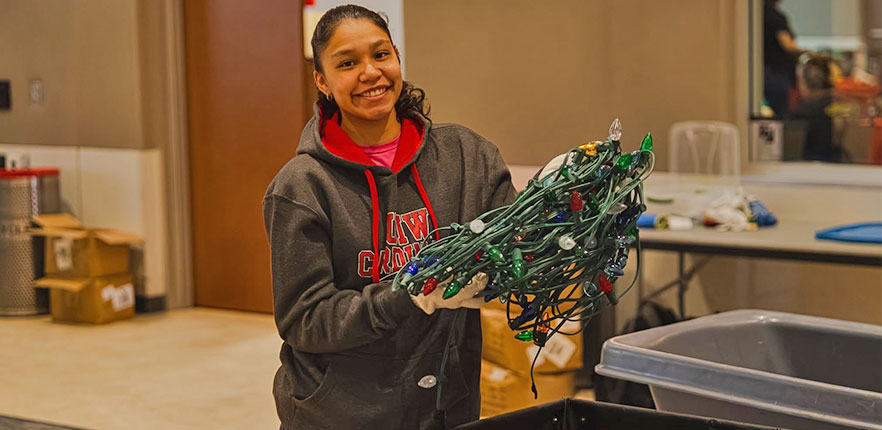 Student volunteer preparing Light the Way lights