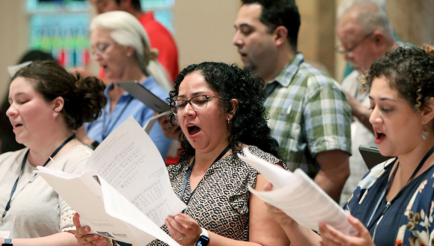 Attendees singing
