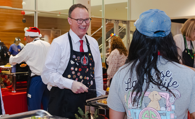 Dr. Thomas Evans serving students at Posada