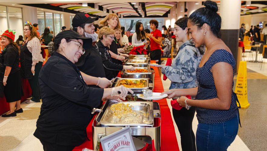 UIW staff and faculty serving students food