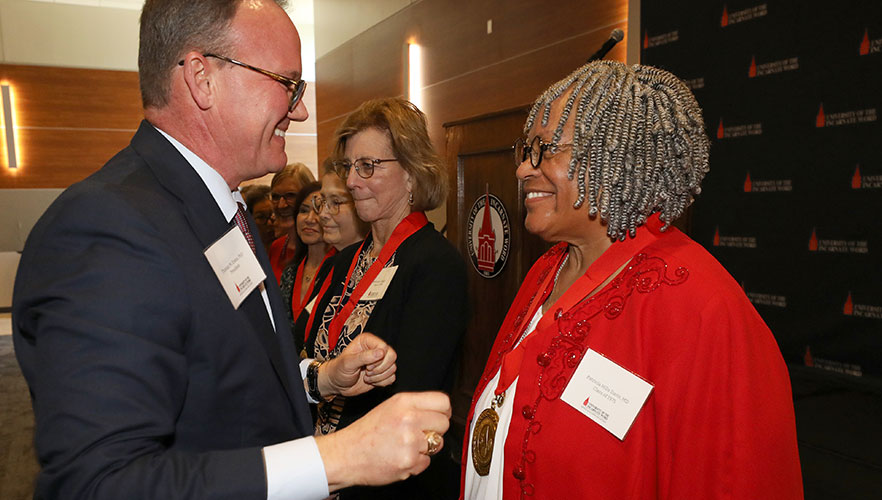 Dr. Thomas M. Evans with reunion attendee